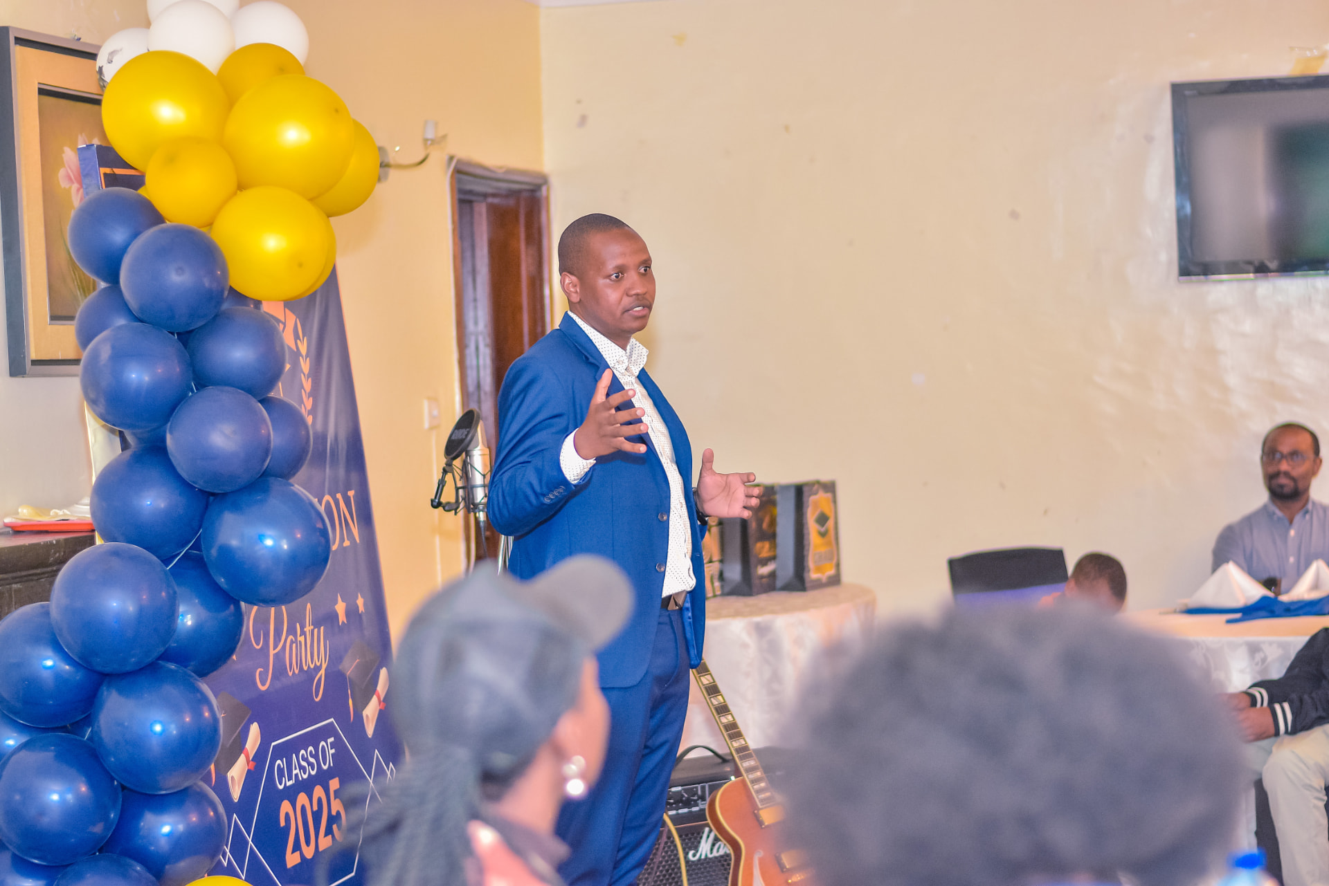 LifeHack school leader addressing families at the Class of 2025 graduation celebration